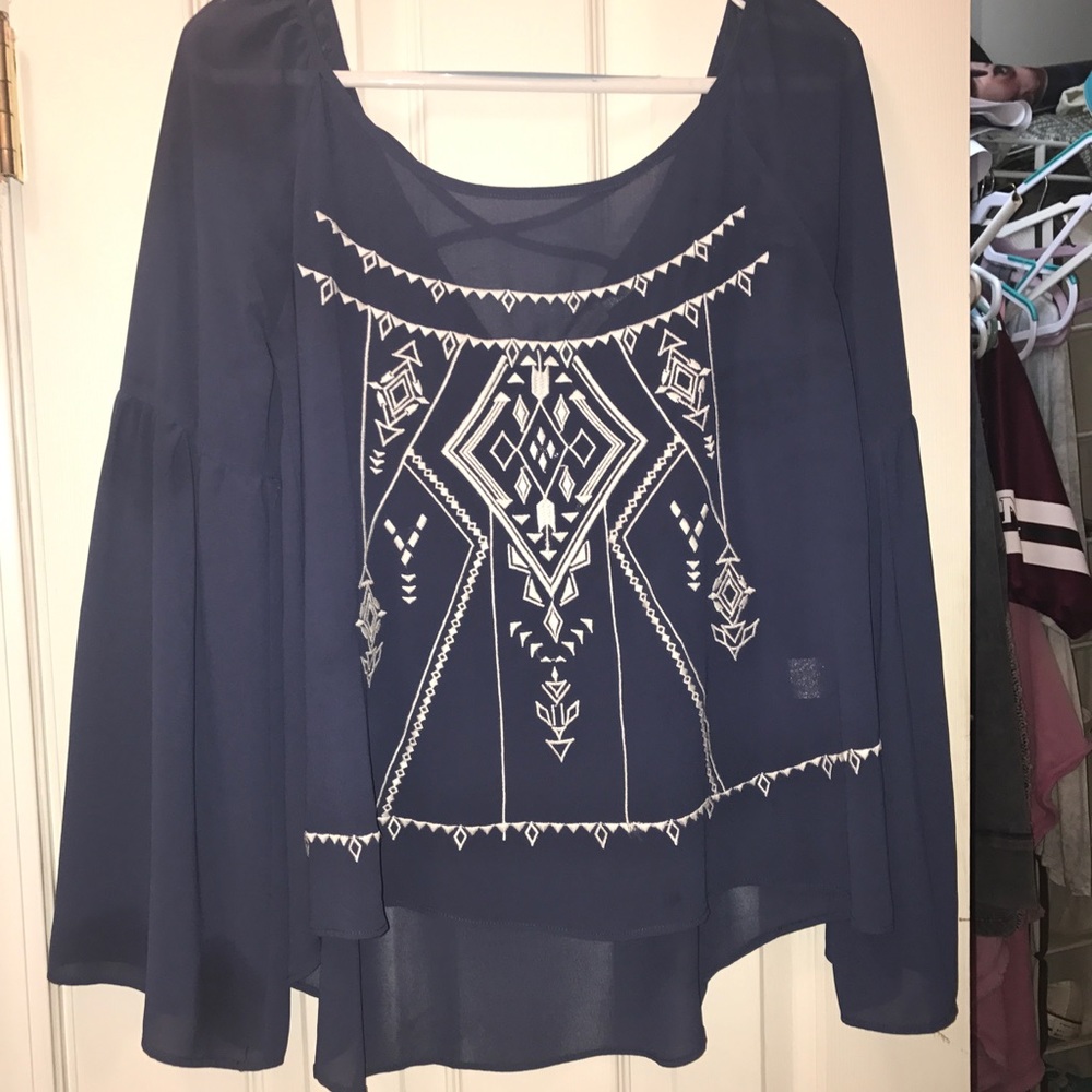 Navy blue long sleeve top with white print